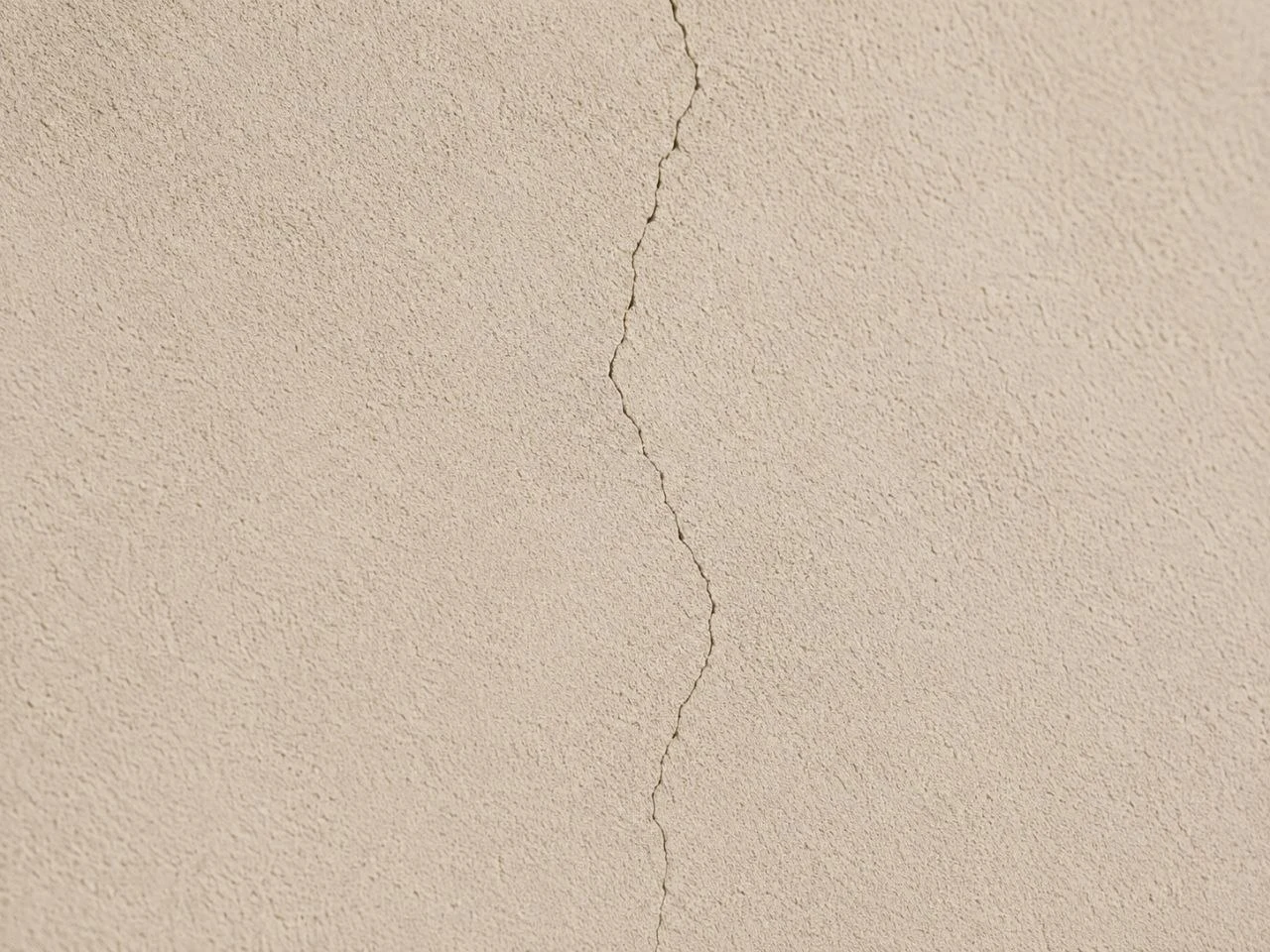 Small hairline crack in stucco